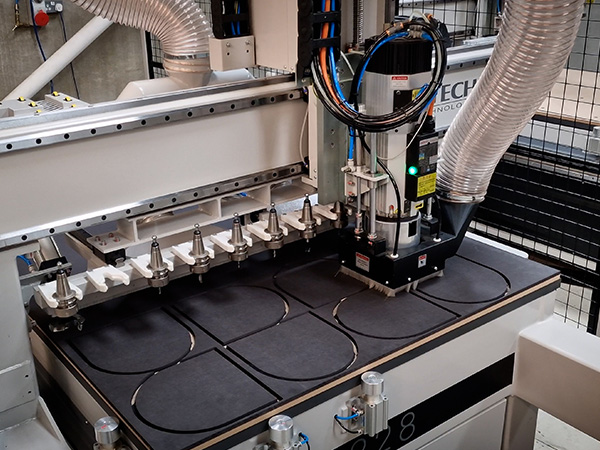 12-slot linear rack automatic tool changer under gantry on EK Series CNC nesting router UK and Ireland