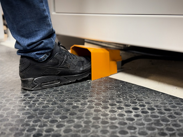 Foot pedal controlling vacuum pop-up material location pins on EK Series CNC nesting router UK and Ireland