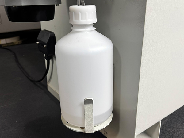 PowlTech PE3 spray release and cleaning agent reservoirs at infeed and outfeed for UK furniture production